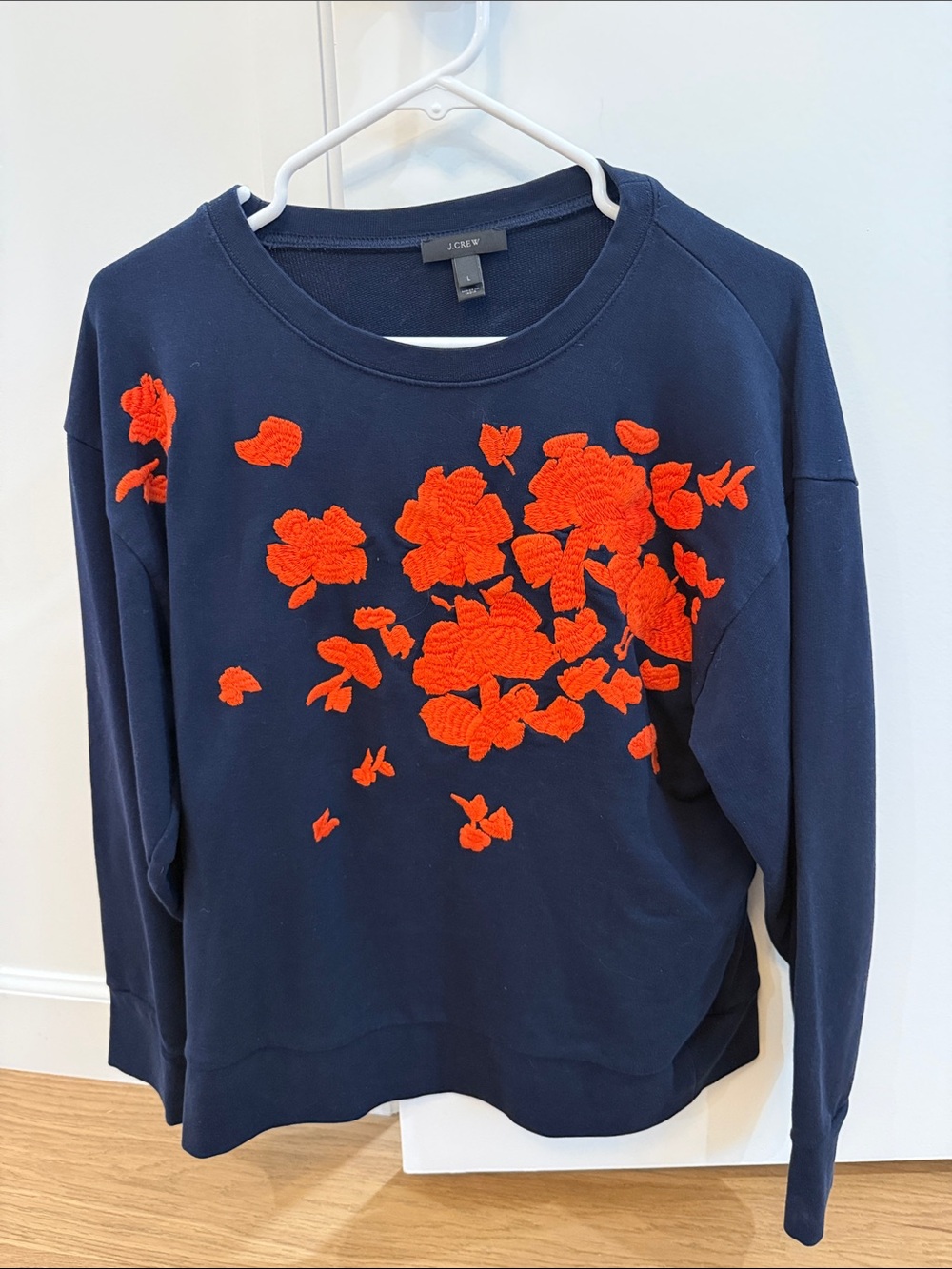 J. Crew Navy Sweatshirt with Bright Orange Floral Appliqué
